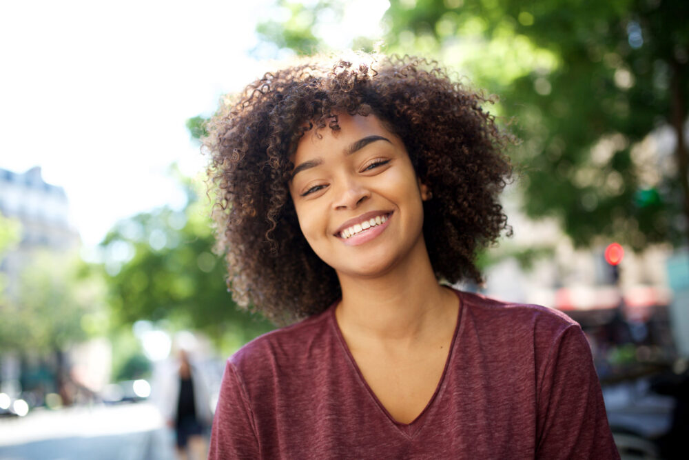 Close up portrait of smiling african American girl with curly hair