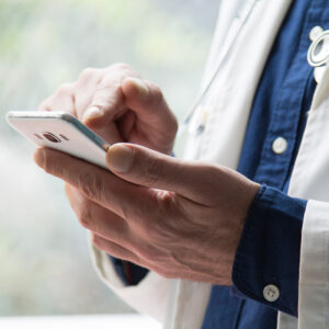 doctor using mobile phone close up view